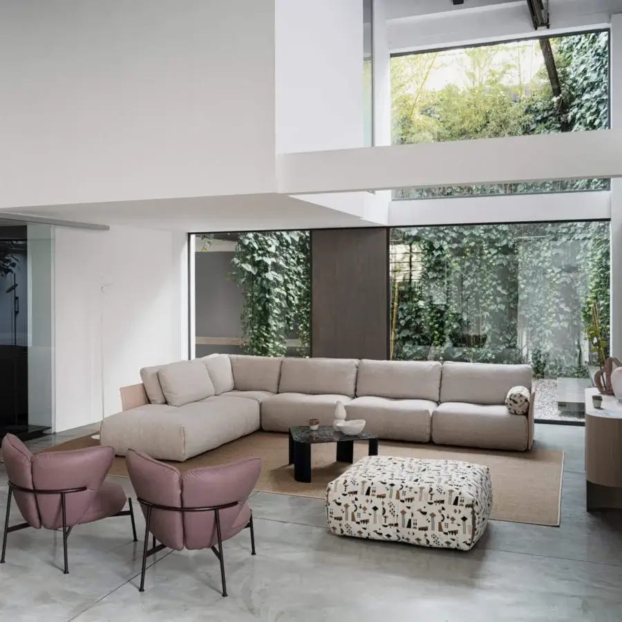 Superior Cierre1972 Tab sectional with raw edges upholstered in light beige textile with a matte finish