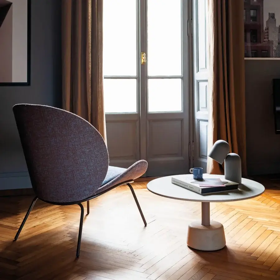 Lavish Bross Baltea lounge chair with blended brown and blue textured fabric upholstery and dark matte metal legs