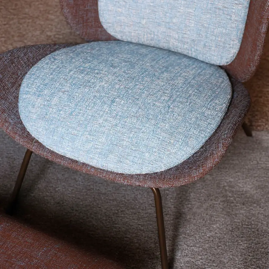 Exceptional Bross Baltea lounge chair with light blue fabric upholstery and slender bronze metal legs crafted in Italy