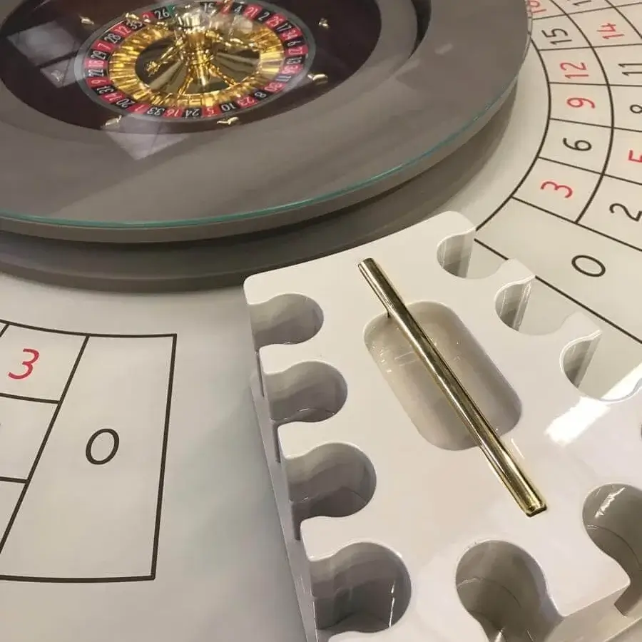 Superior Vismara Convivium roulette table with lacquered glass top and white lacquered rings base with golden accents