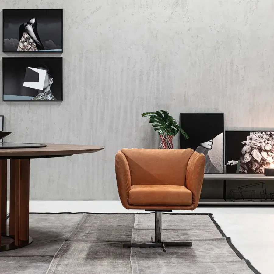 Elegant Cierre1972 Mademoiselle swivel armchair with warm tan textile upholstery and uniform single-color finish
