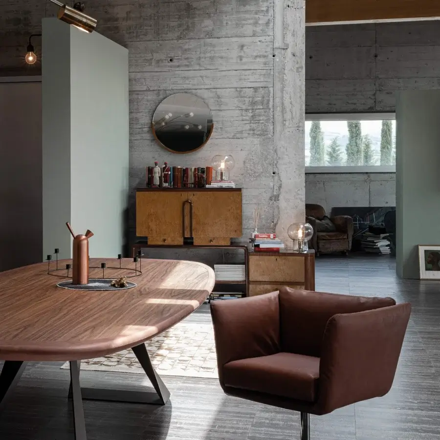 Elegant Cierre1972 Mademoiselle swivel armchair upholstered in uniform brown textile with a matte finish