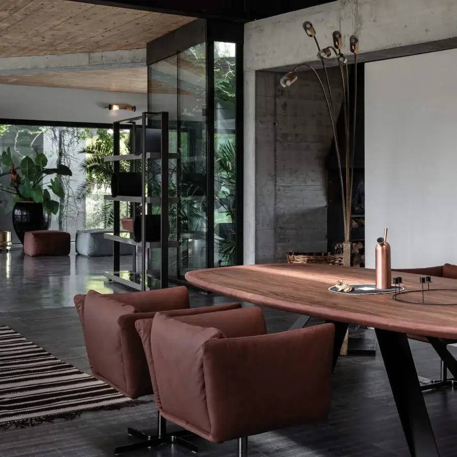 Superior Cierre1972 Mademoiselle swivel armchair enveloped in smooth brown textile with a rounded, contemporary form