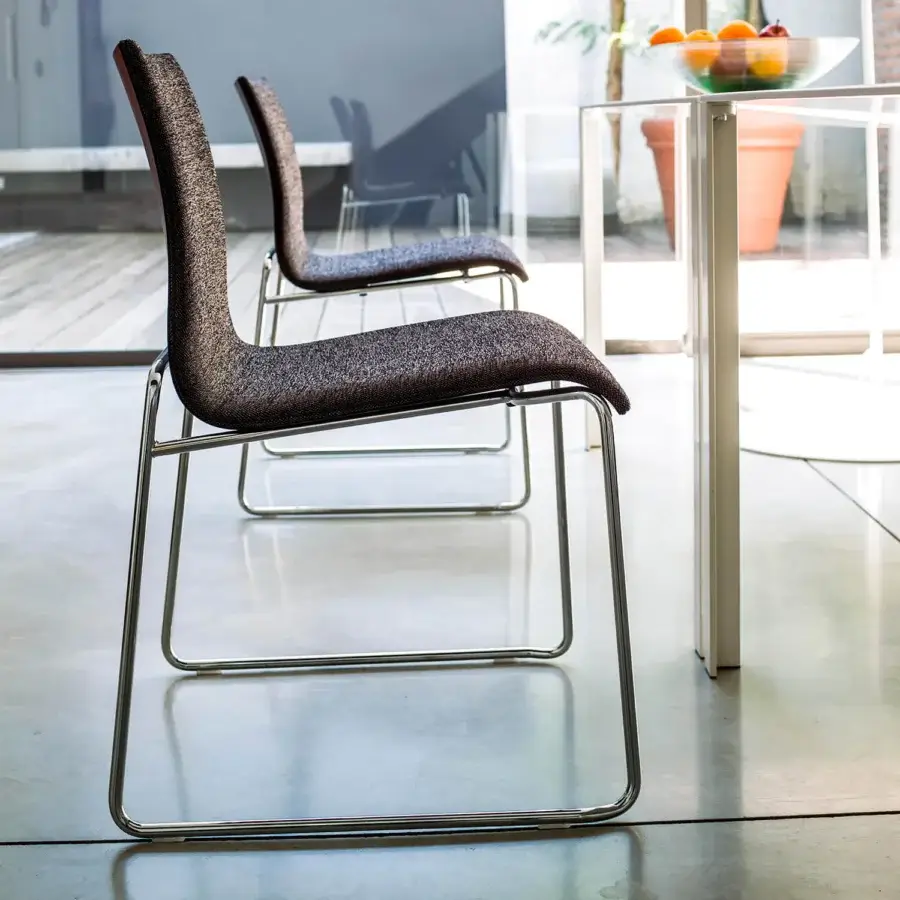 Distinguished Bross Bee chair with a metal frame and premium fabric upholstery in dark grey and brown tones with a polished finish