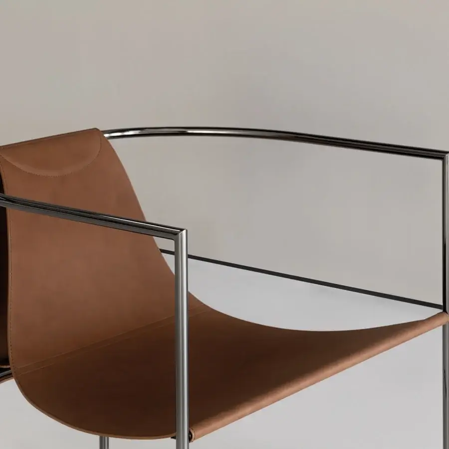 Distinguished Cierre1972 Jamiro lounge chair with “cuoio effect” brown leather seat and glossy silver-toned metal frame