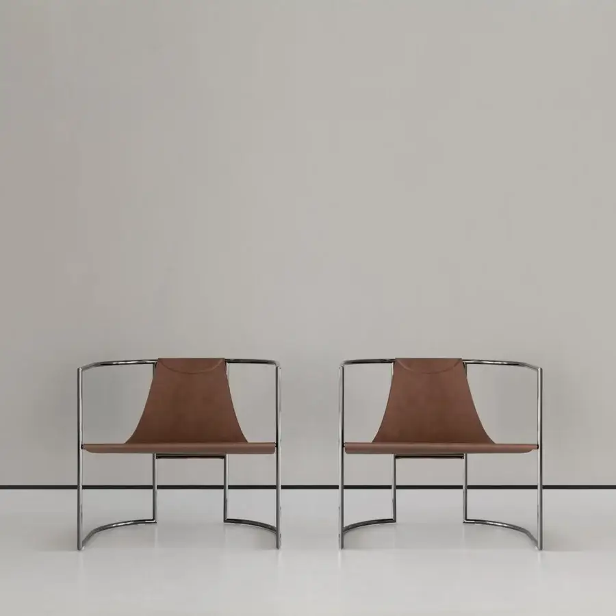 Distinguished Cierre1972 Jamiro lounge chair with curved chrome metal frame and brown leather exhibiting “cuoio effect” finishing