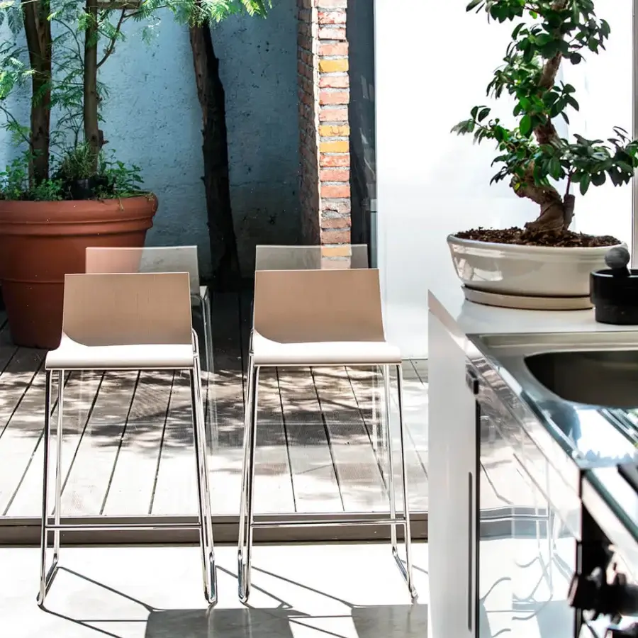 Distinguished Bross Bee stool crafted in Italy with light beige wood seat and back with shiny chrome metal base and matte finish