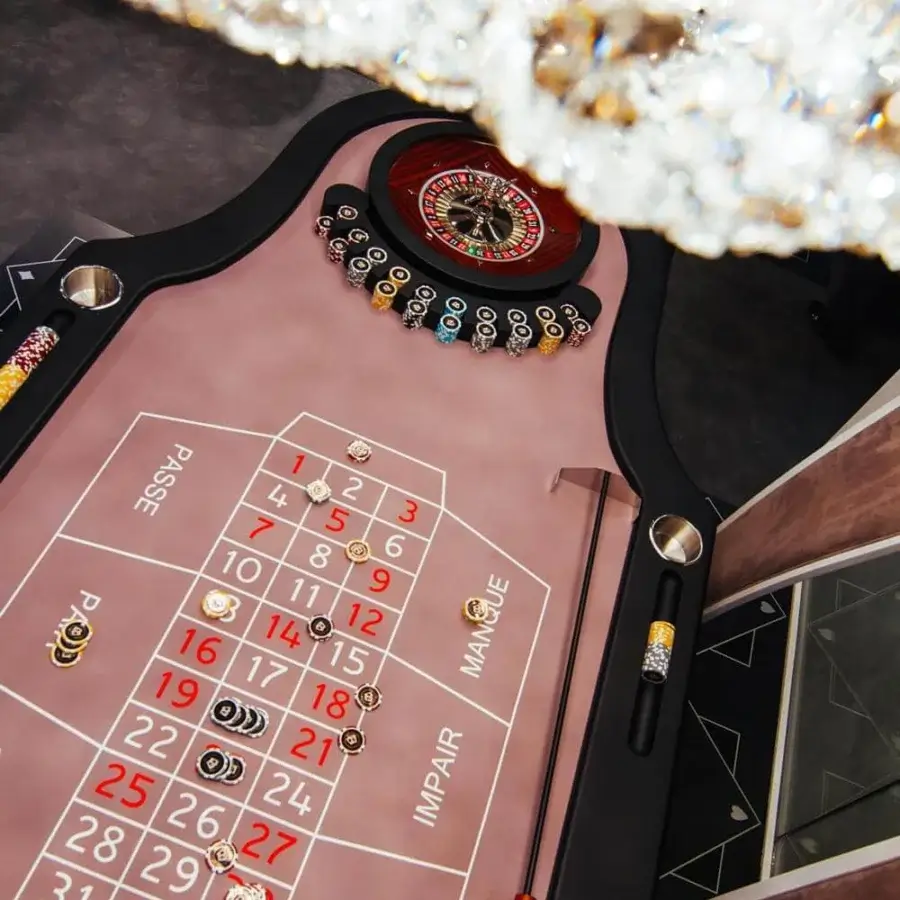 Distinguished Vismara Montecarlo roulette table with light pink lacquered glass and black soft touch lacquered edge presenting a smooth finish
