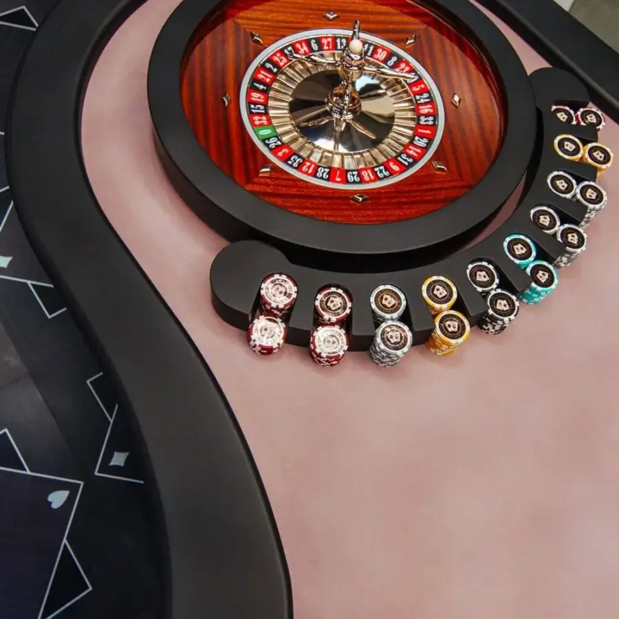 Superior Vismara Montecarlo roulette table with light pink lacquered glass and patterned wood grain wheel