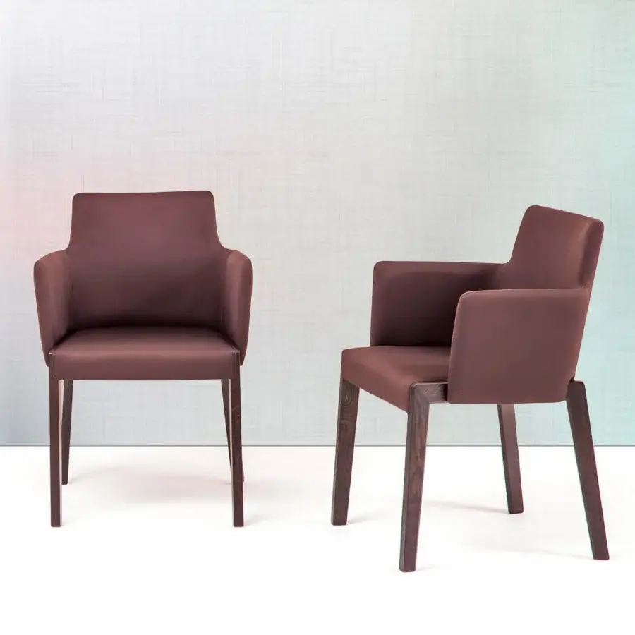 Superior Bross Bridget armchair crafted in Italy with brown fabric upholstery and high-end wood legs exhibiting a smooth finish