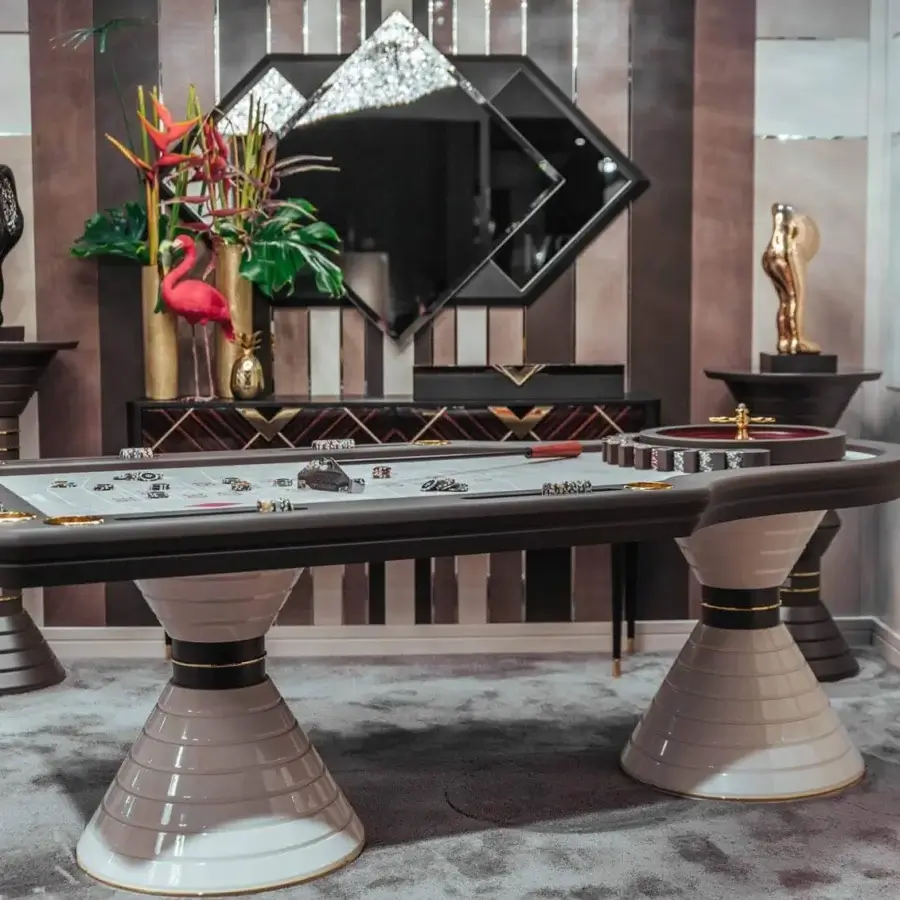Distinguished Vismara Montecarlo roulette table with light-colored lacquered glass and gradient ringed bases built with steel profiles