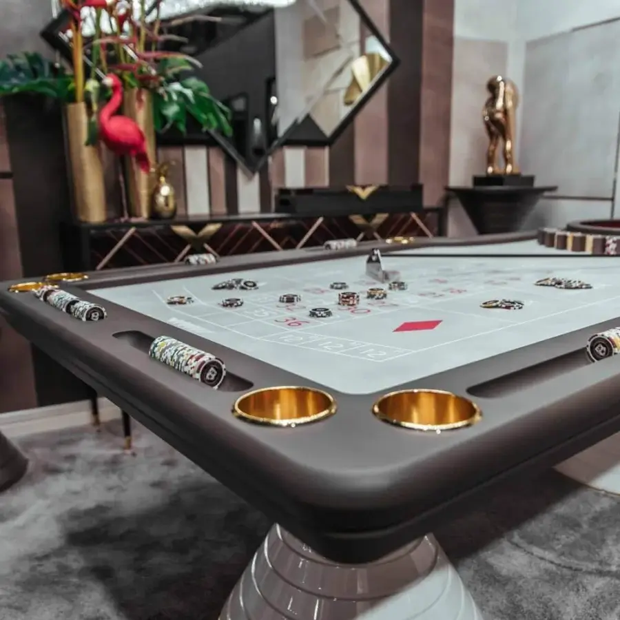Distinguished Vismara Montecarlo roulette table with dark gray lacquered glass and a gilded pedestal base crafted in steel