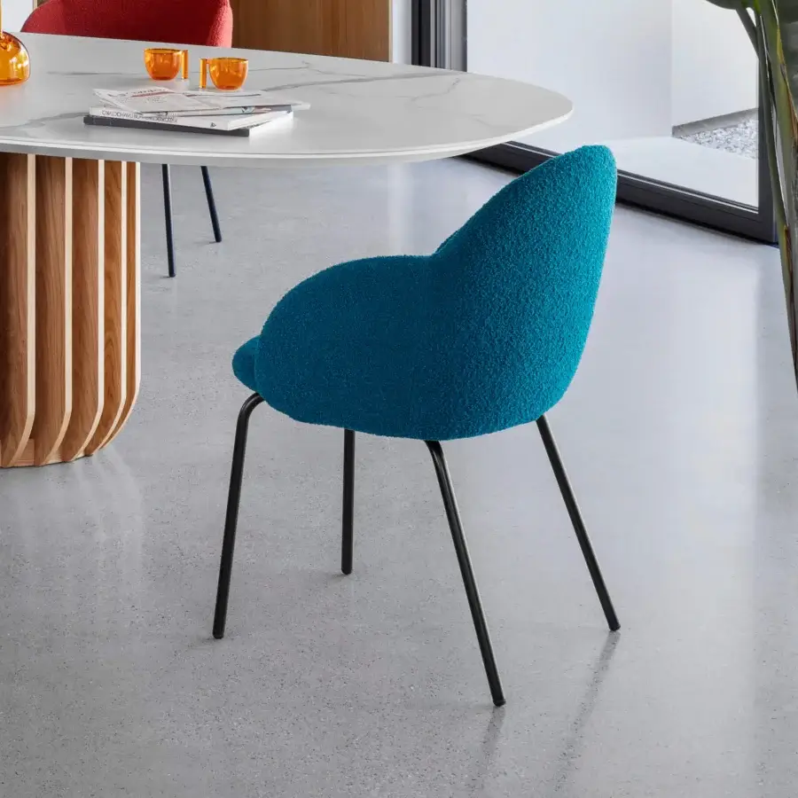 Elegant Miniforms Iola armchair with vibrant blue looped textile and slender matte black metal legs