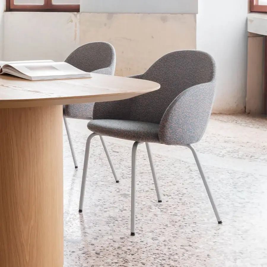 Distinguished Miniforms Iola armchair with speckled gray and pinkish-orange textile and slender matte light gray metal legs