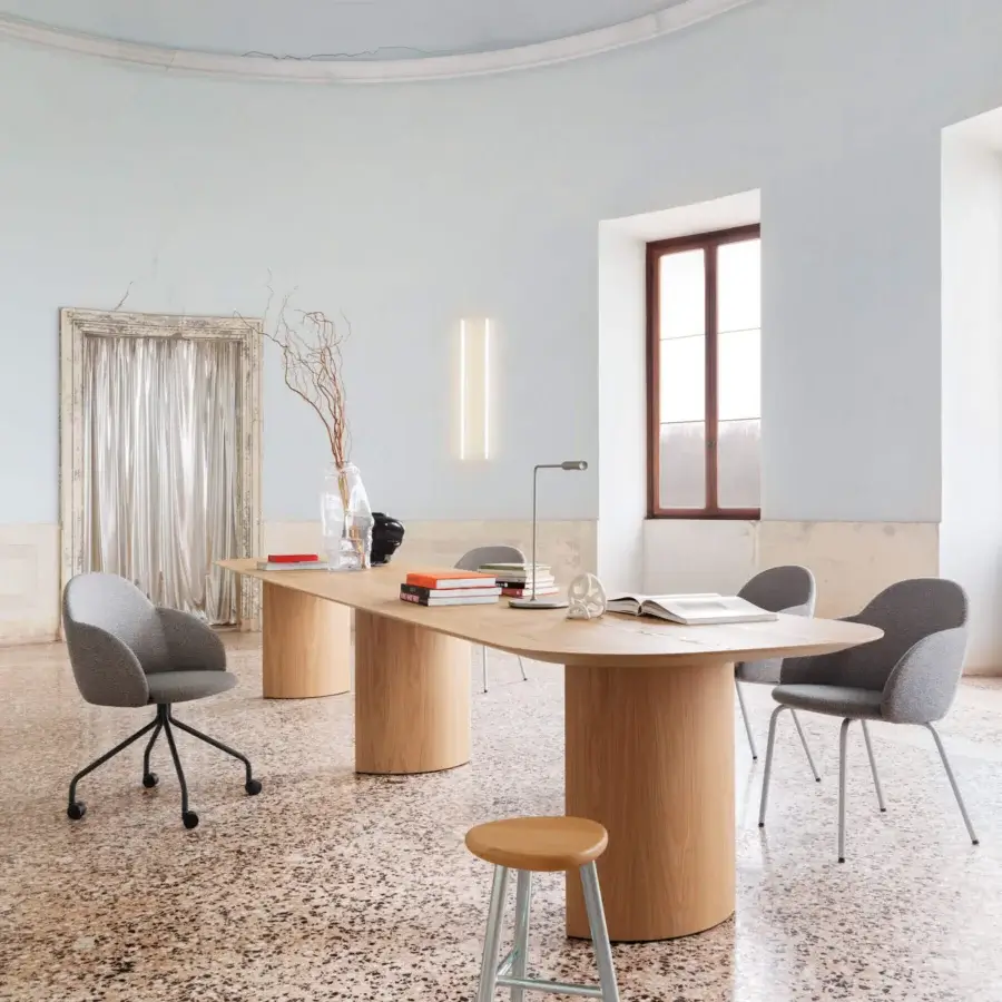 Elegant Miniforms Iola armchair upholstered in sleek grey textile with slender black finished metal legs crafted in Italy