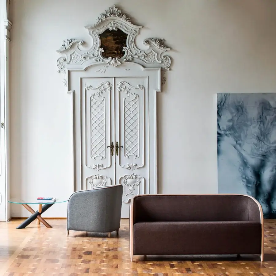 Elegant Bross Brig sofa with a solid brown textile and light natural wood structure crafted in Italy
