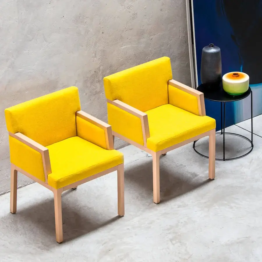 Captivating Bross Flux armchair with a geometric wood structure and premium yellow fabric upholstery with a smooth matte finish