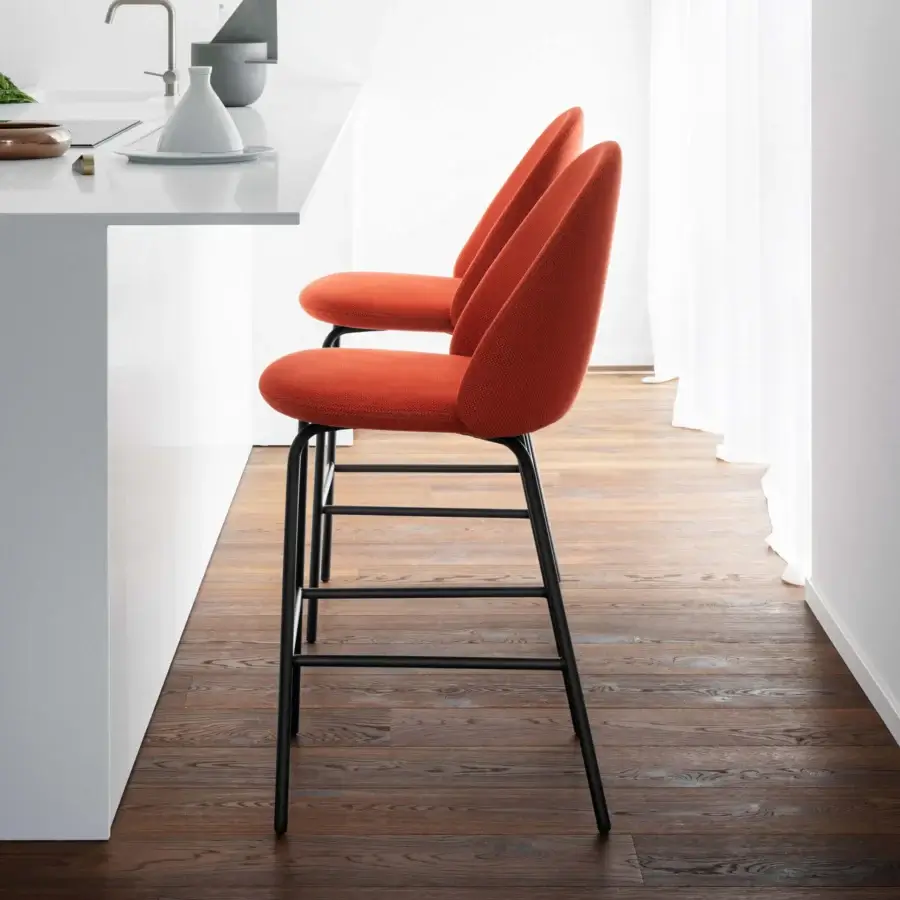 Distinguished Miniforms Iola stool upholstered in coarse-weave matte orange textile with slender metal legs