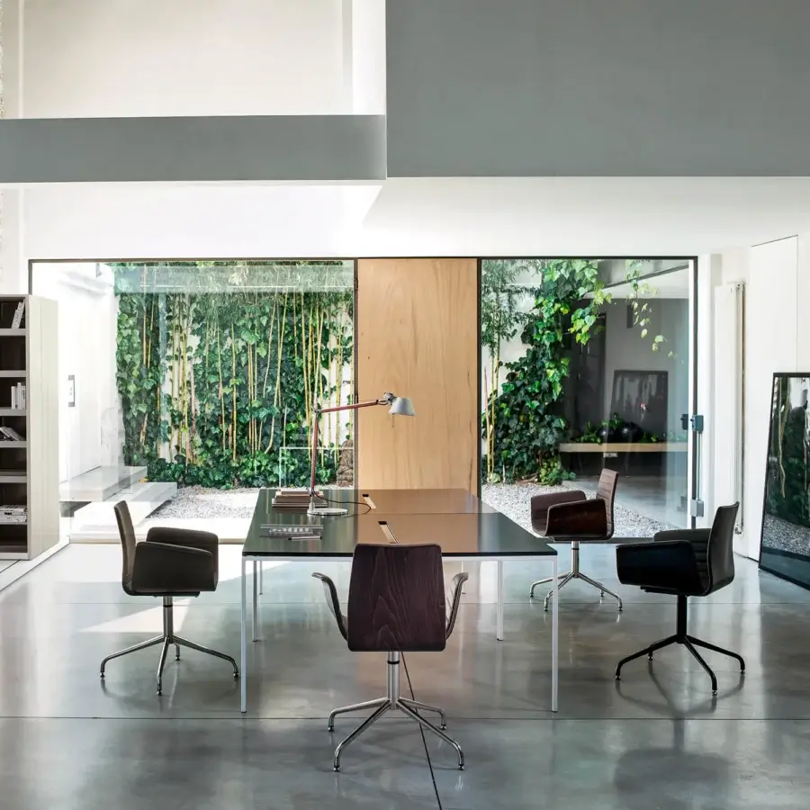 Exclusive Bross Meeting armchair with quilted leather front and dark brown wood rear back with satin metal legs