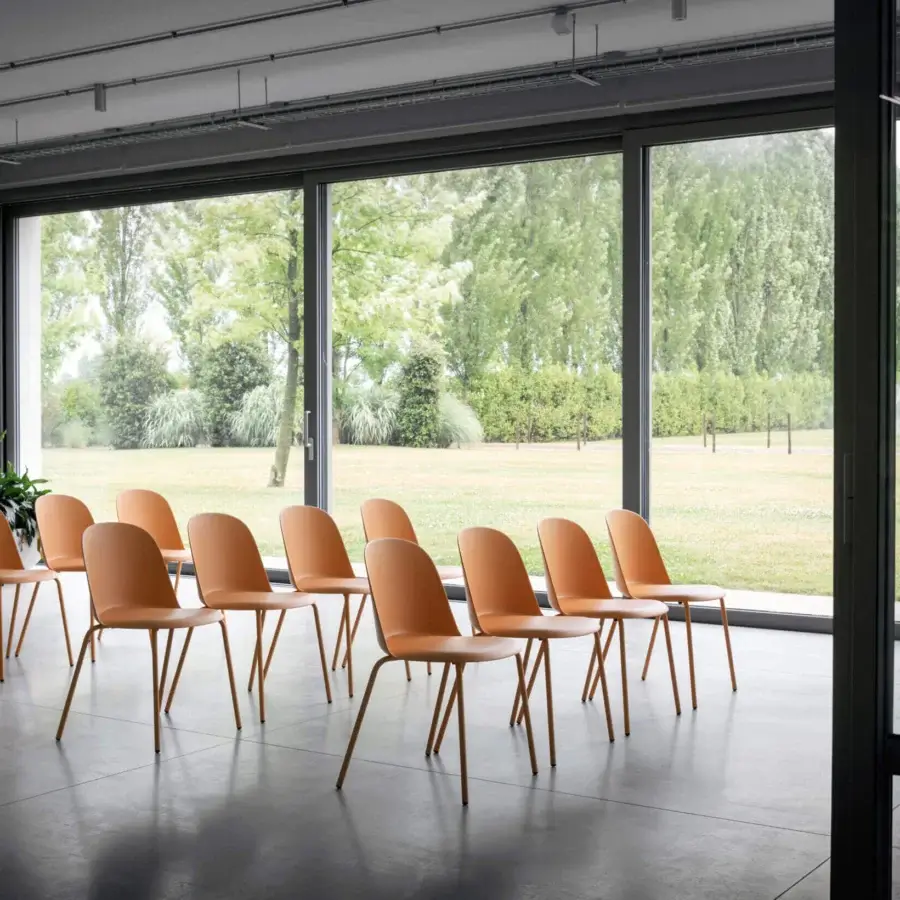 Elegant Miniforms Mariolina Basic chair in peach polypropylene with clean lines and a matte finish