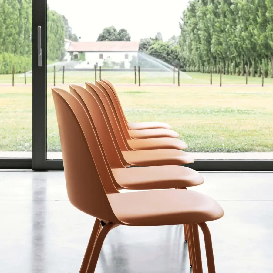 Superior Miniforms Mariolina Basic chair in light brownish-orange polypropylene with continuous curved lines and matte finish