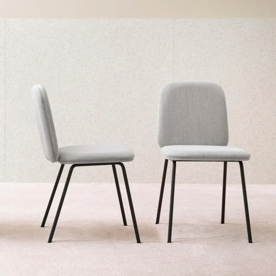 Elegant Miniforms Leda chair with light gray textile upholstery and black matte metal frame and legs