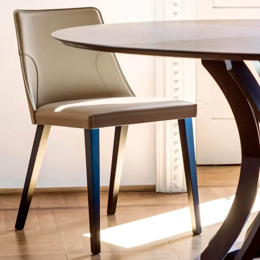 Exclusive Bross Ned chair with smooth beige premium leather upholstery and striking two-tone wood legs