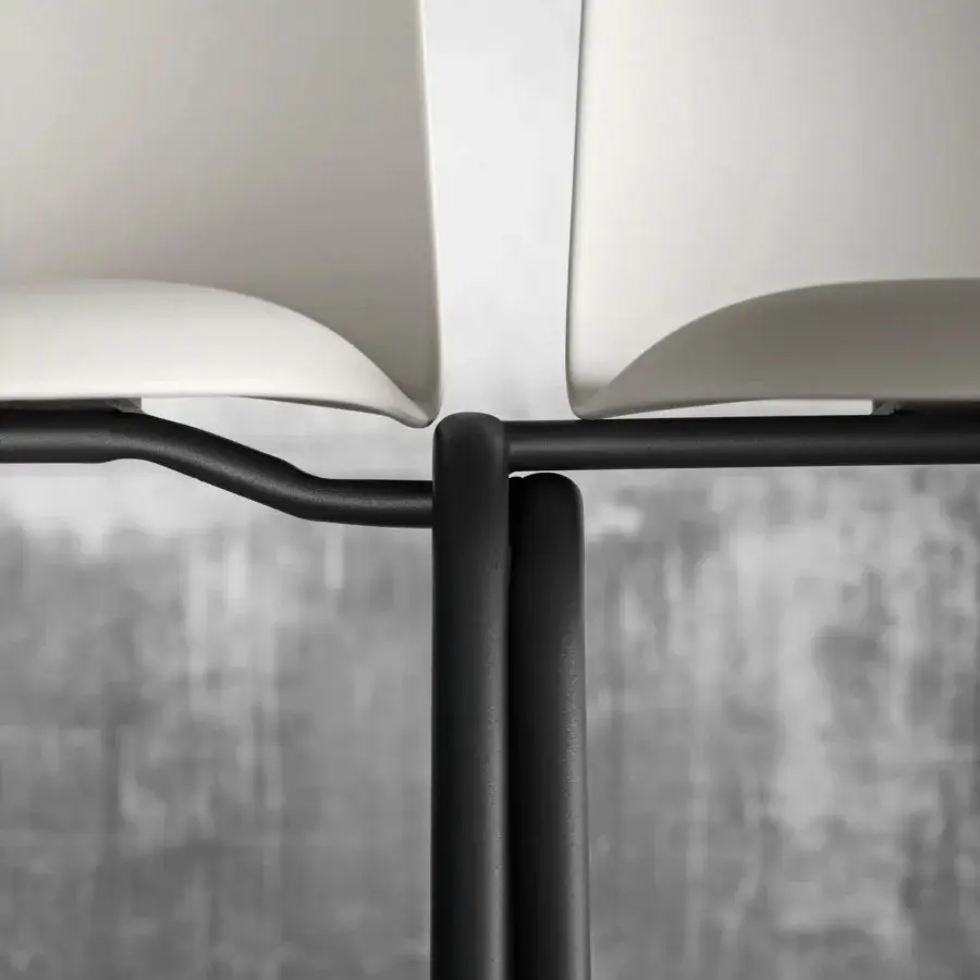 Distinguished Miniforms Mariolina Edu chair with curved white polypropylene seat and black metal frame