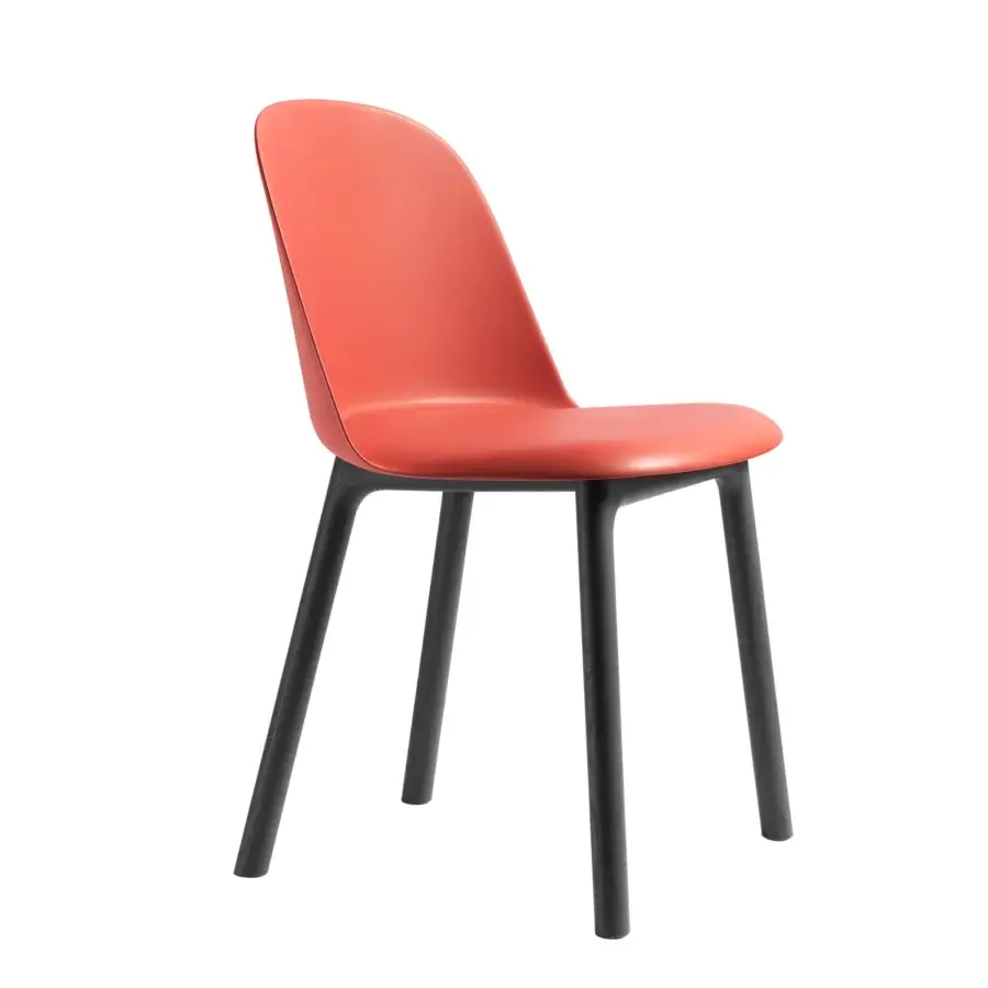 Distinguished Miniforms Mariolina Wood chair with curved reddish-orange polypropylene and dark-toned wooden legs