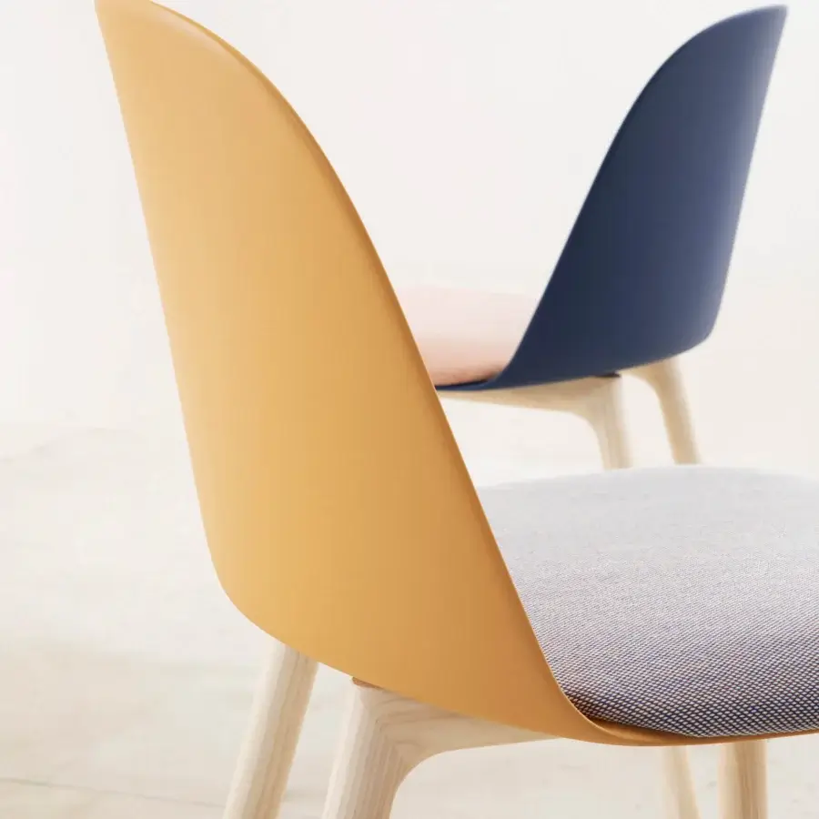 Exceptional Miniforms Mariolina Wood chair with curved mustard yellow polypropylene and light grey upholstered seat built with light-toned wooden legs
