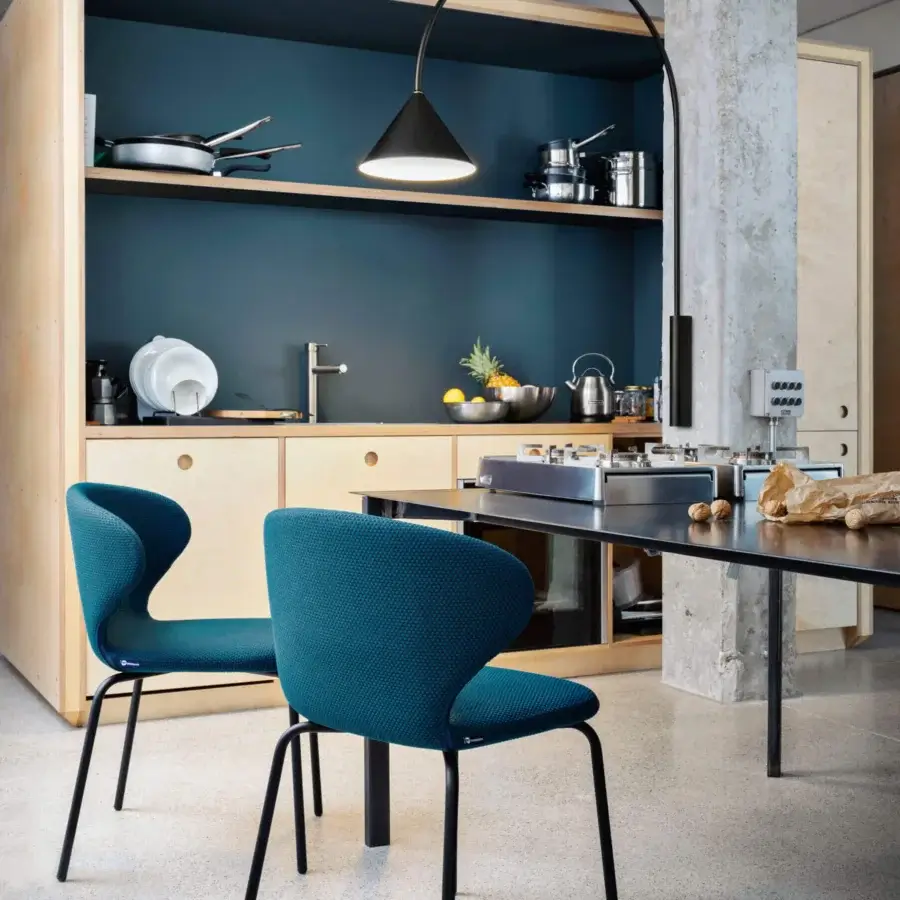 Elegant Miniforms Mula Basic chair with blue textured textile upholstery and slender black metal legs