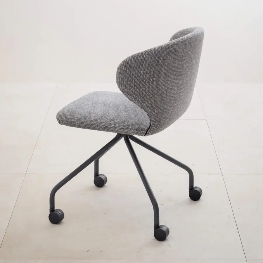 Miniforms Mula office chair, gray fabric upholstery, curved backrest, black five-star base, angled legs, modern design, neutral palette.