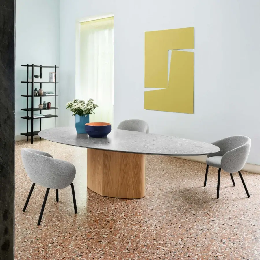 Superior Miniforms Nebula Tube chair upholstered in light gray textile with dark metal legs crafted in Italy