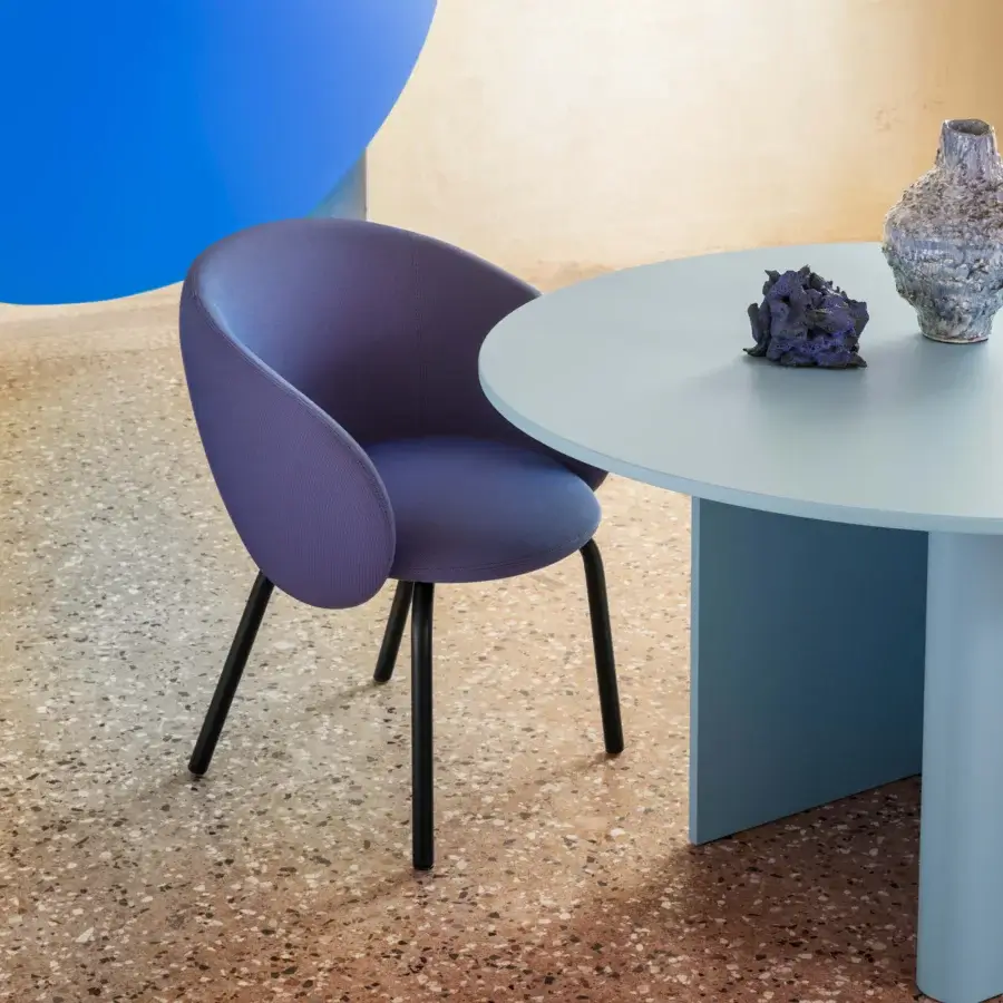 Elegant Miniforms Nebula Tube chair upholstered in muted purple woven textile with black metal legs
