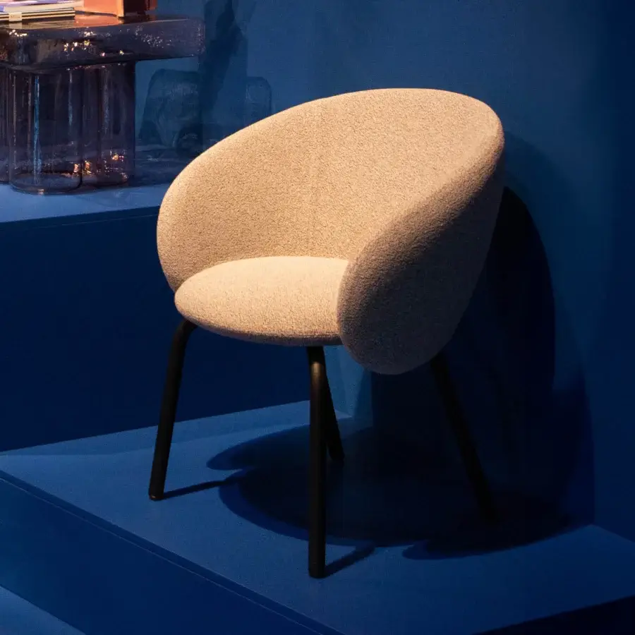 Exceptional Miniforms Nebula Tube chair upholstered in warm beige textile with matte finish and dark metal legs
