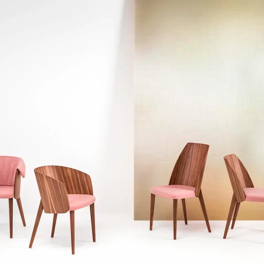 Exceptional Bross Shell chair with soft pink fabric and smooth, medium-toned wood crafted in Italy