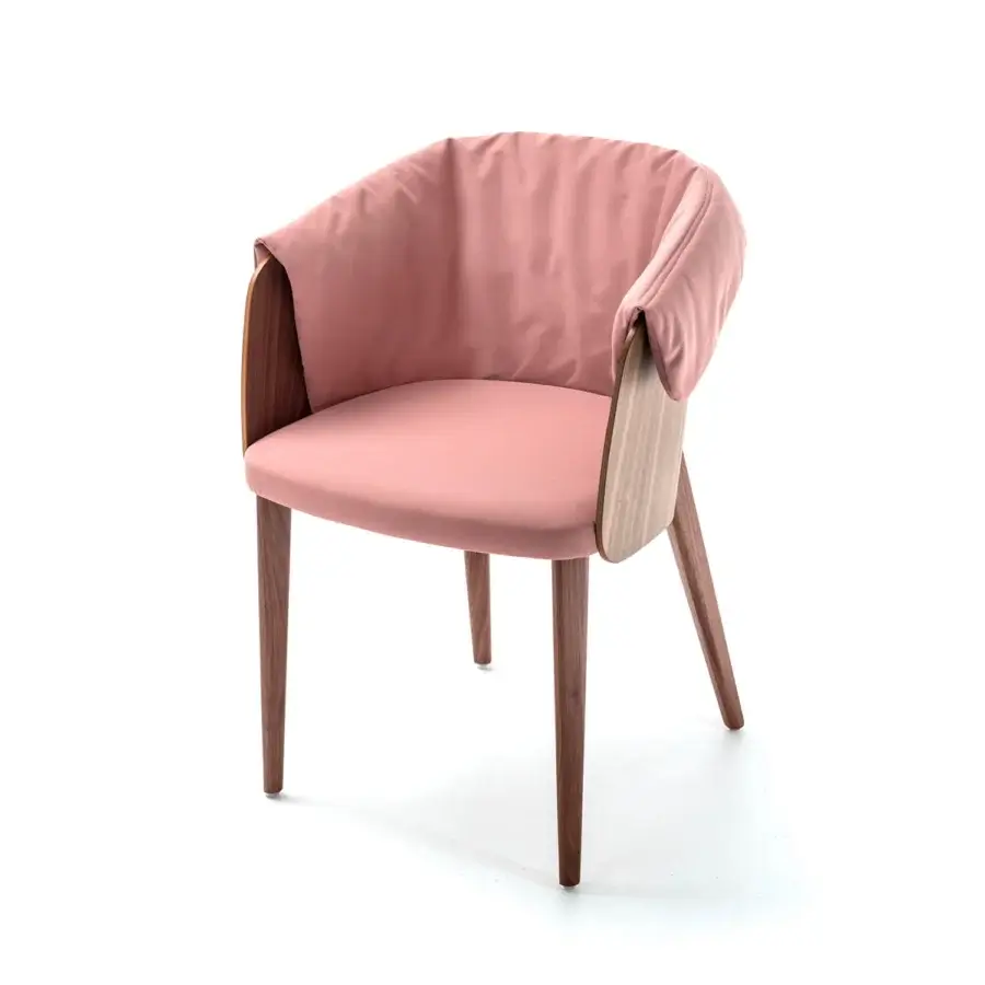 Innovative Bross Shell armchair with curved plywood, embracing form and muted pink premium fabric upholstery crafted in Italy