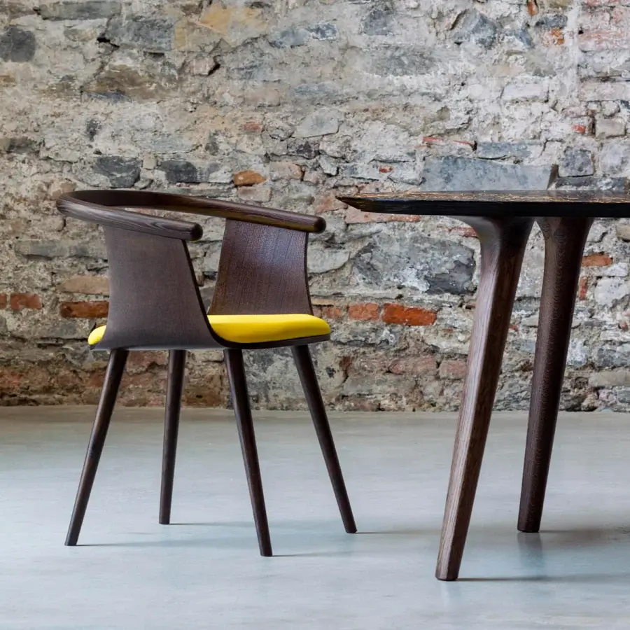 Harmonious Bross Yuumi armchair with vibrant yellow seat cover and high-end ashwood structure crafted in Italy