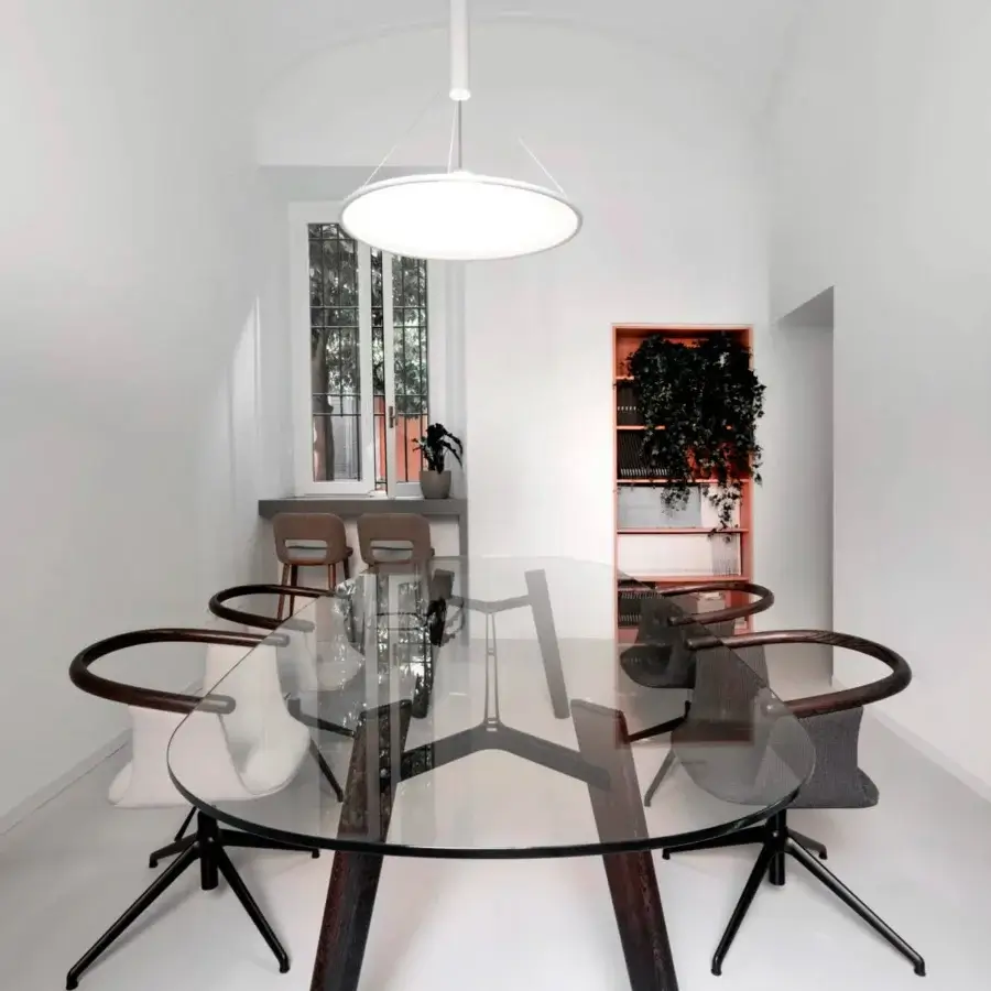 Superior Bross Beleos table with extra clear glass and a dark lacquered metal beam crafted in Italy
