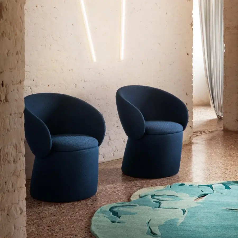 Captivating Miniforms Nebula Monaca chair with enveloping form and teardrop arms in deep blue recyclable polyurethane with matte finish