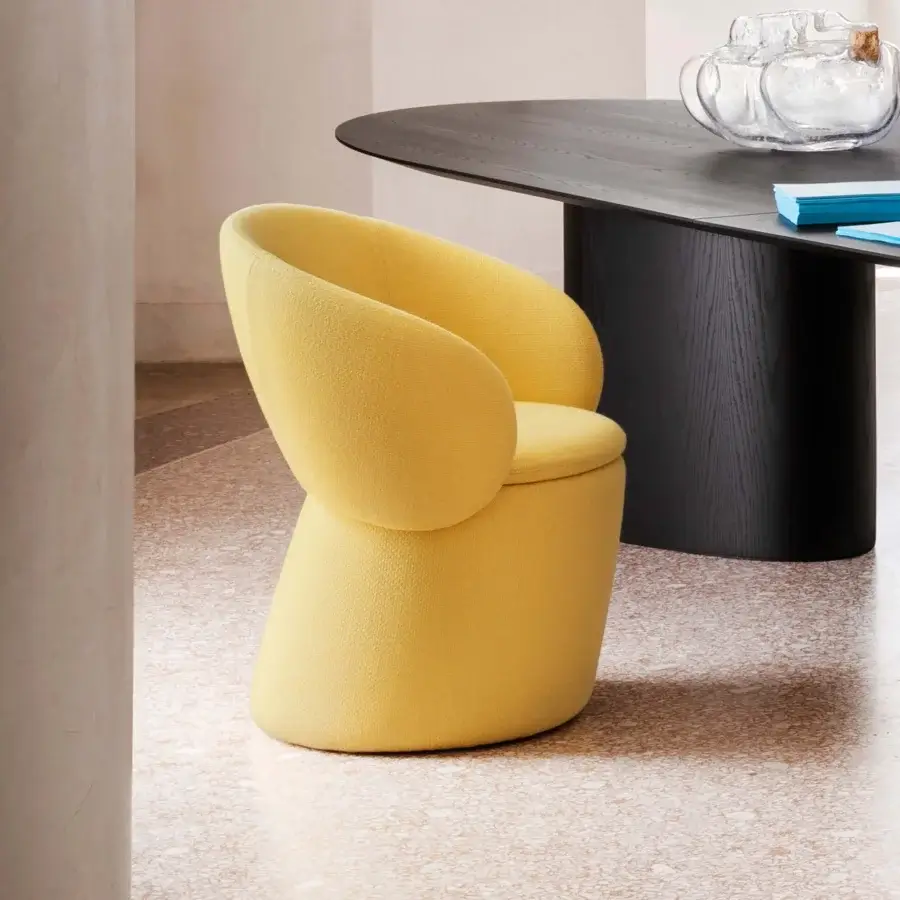 Distinguished Miniforms Nebula Monaca chair with enveloping form upholstered in textured matte yellow recyclable polyurethane