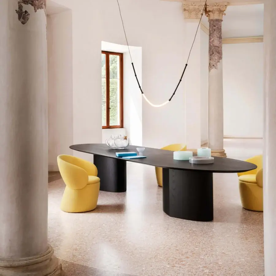 Remarkable Miniforms Nebula Monaca chair with enveloping aesthetic and distinctive arms crafted in matte yellow textile with recyclable polyurethane shell