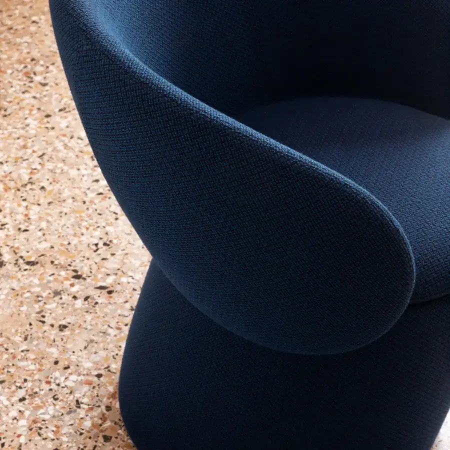 Superior Miniforms Nebula Monaca chair with enveloping design upholstered in textured dark blue recyclable polyurethane shell