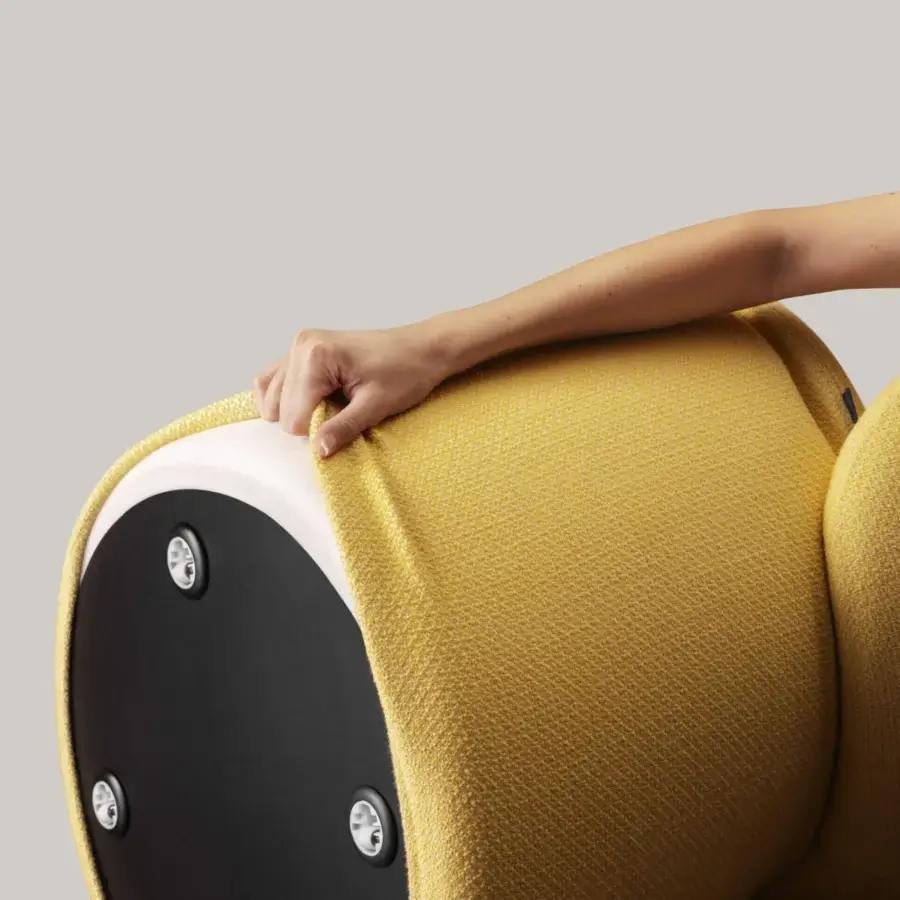 Exclusive Miniforms Nebula Monaca chair with enveloping design and sleek lines in muted yellow woven textile with a black circular base