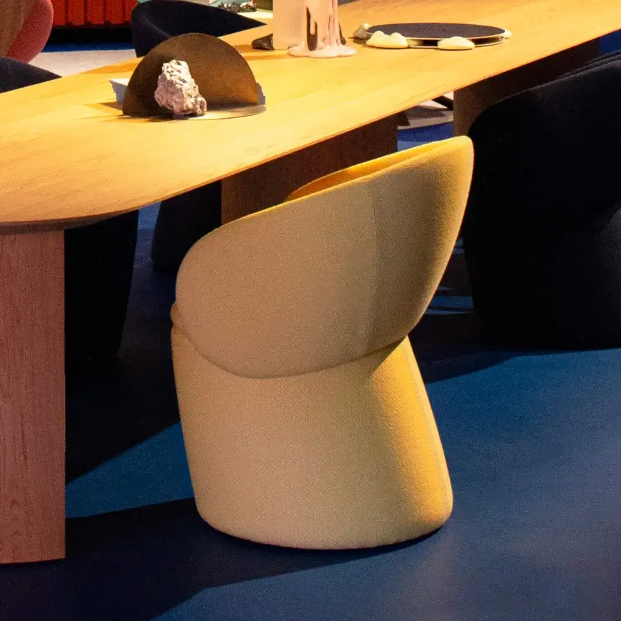 Superior Miniforms Nebula Monaca chair with dense enveloping design in light yellowish-tan recyclable polyurethane with matte finish