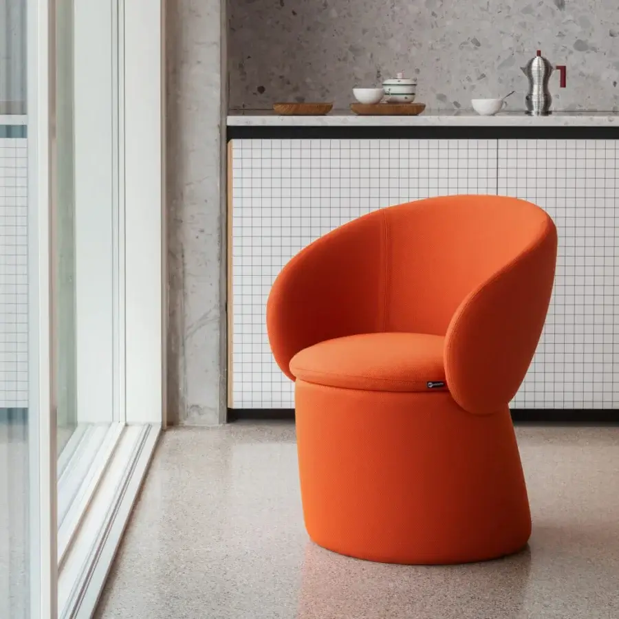 Superior Miniforms Nebula Monaca chair with enveloping design, curved lines and matte orange textile upholstery
