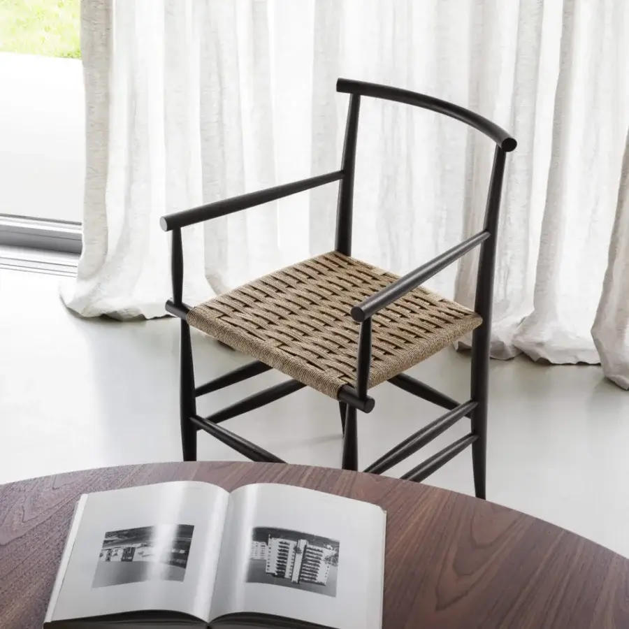 Elegant Miniforms Pelleossa chair with dark wood frame and light brown woven seat exhibiting a matte finish