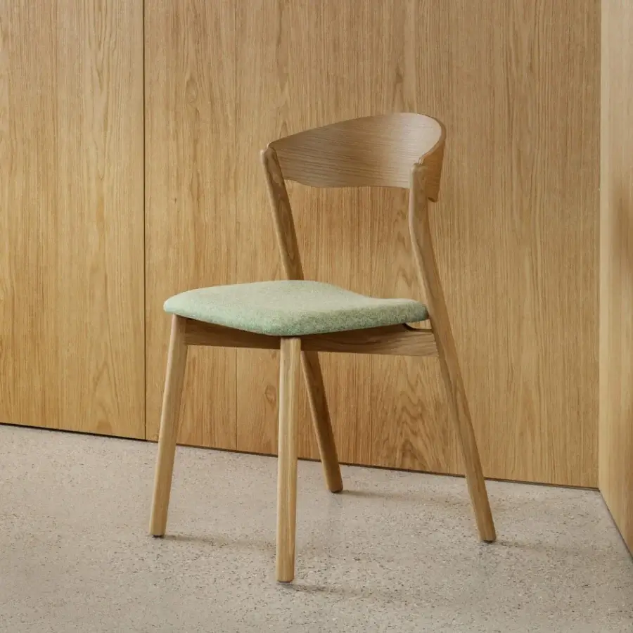 Distinguished Miniforms Tube chair with light green upholstery and smooth light-toned wooden frame crafted in Italy