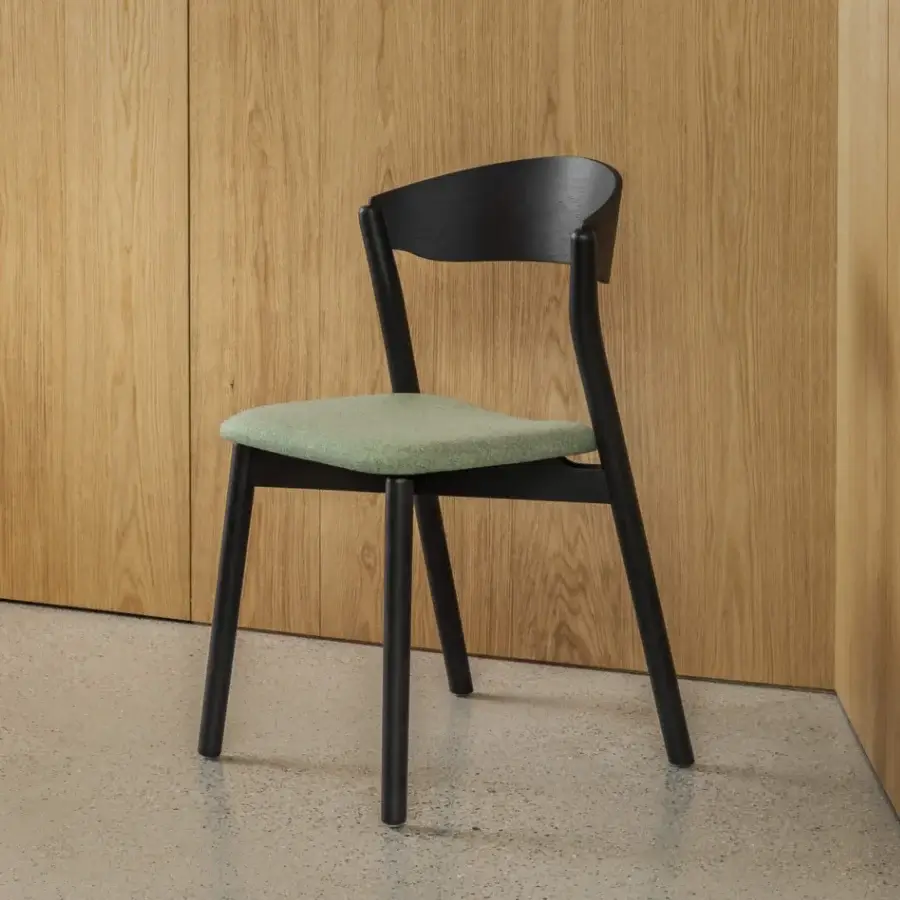 Exceptional Miniforms Tube chair with a curved silhouette in muted green textile and matte black wood frame crafted in Italy