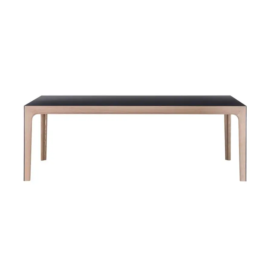 Exceptional Bross Amalong table with a dark matte tabletop and light-toned solid ash frame exhibiting seamless connections